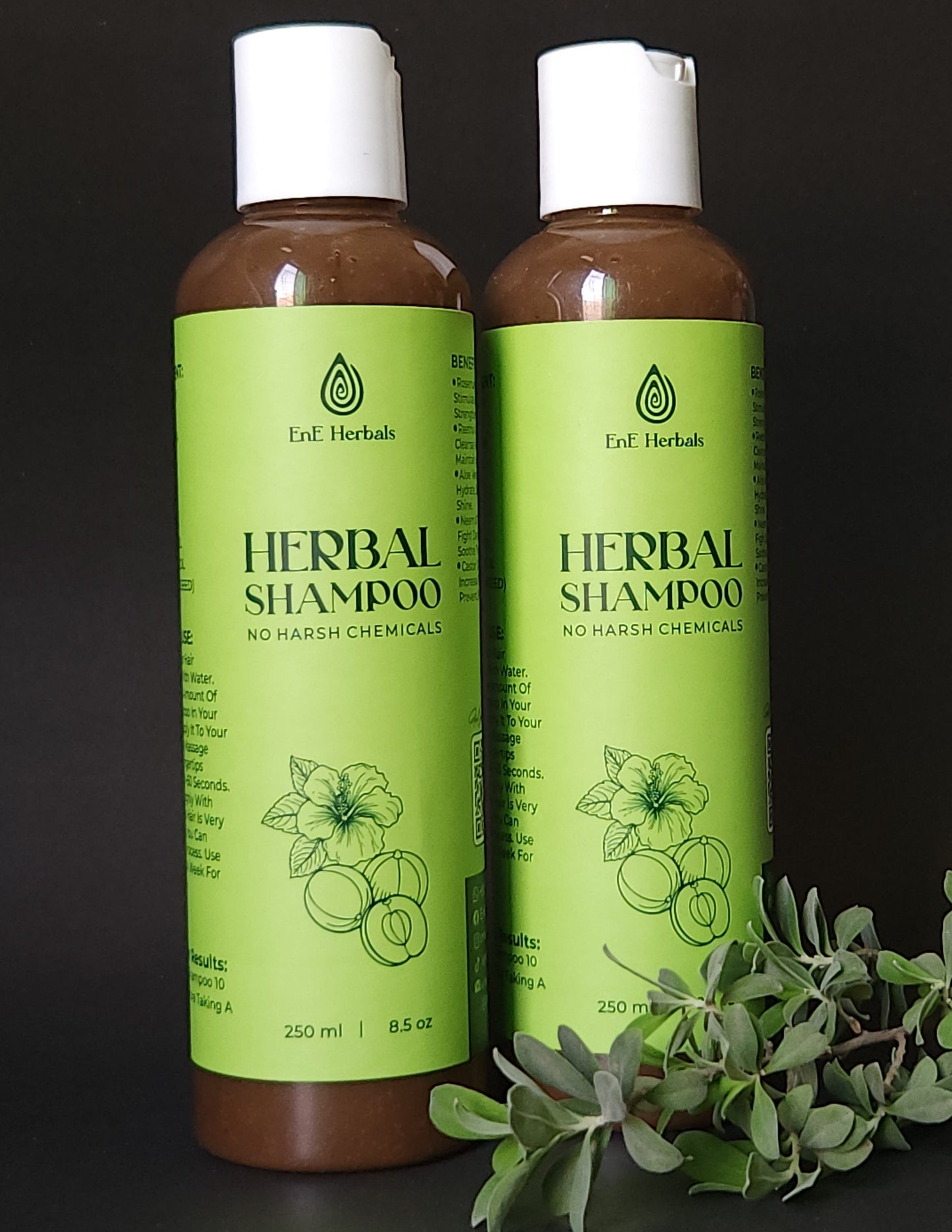 Two bottles of herbal shampoo on a dark background
