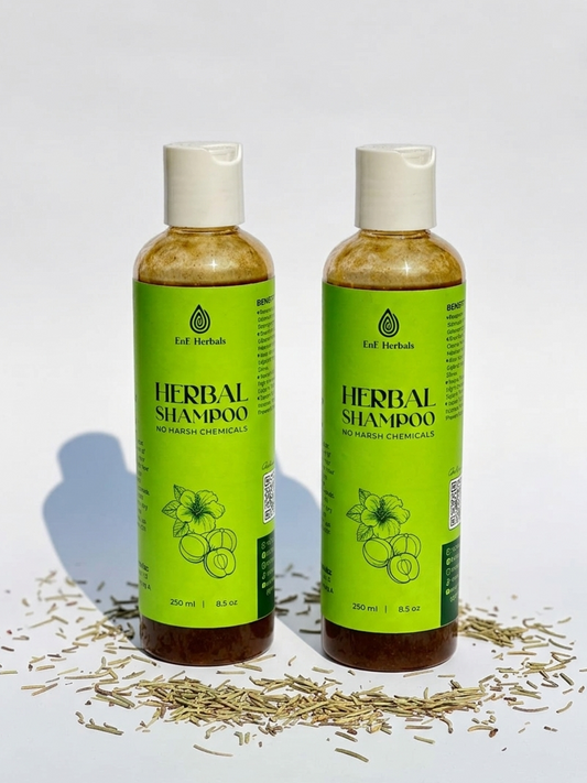 EnE Herbals Essentials Reset Duo featuring two bottles of Natural Herbal Shampoo on a minimal white background with dried rosemary leaves.